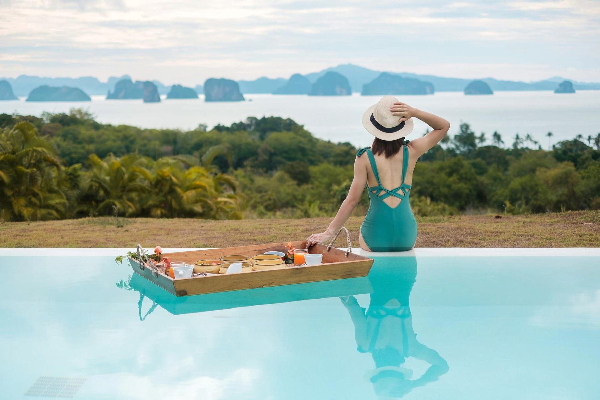 Snorkel mask and fins laid out on a wooden dock in Thailand